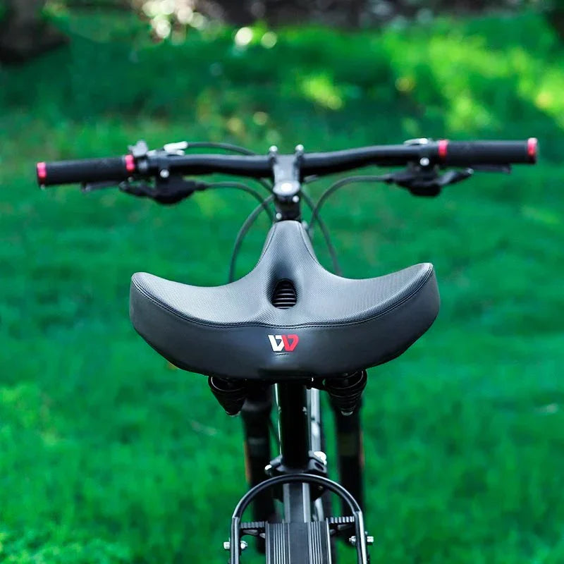 "Comfortabel fietszadel met extra brede zitting, ergonomisch design, ademende bekleding, schokabsorberend schuim."