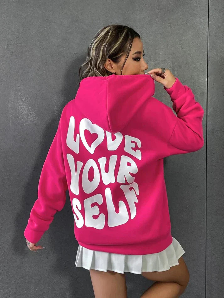Comfortabele hoodie met "Hou van jezelf" spreuk in zachte katoenen stof, verkrijgbaar in diverse kleuren voor dames.