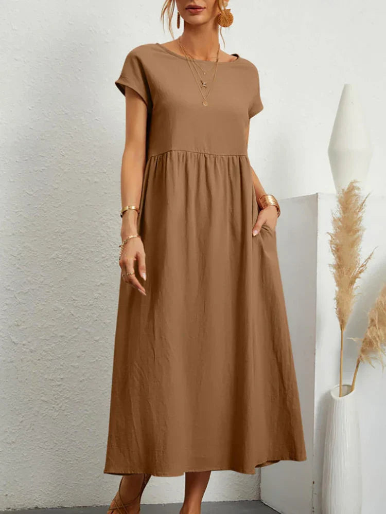 "Comfortabele vintage O-hals zomerjurk van ademend katoen, ideaal voor zomerse dagen; veelzijdige elegante stijl."