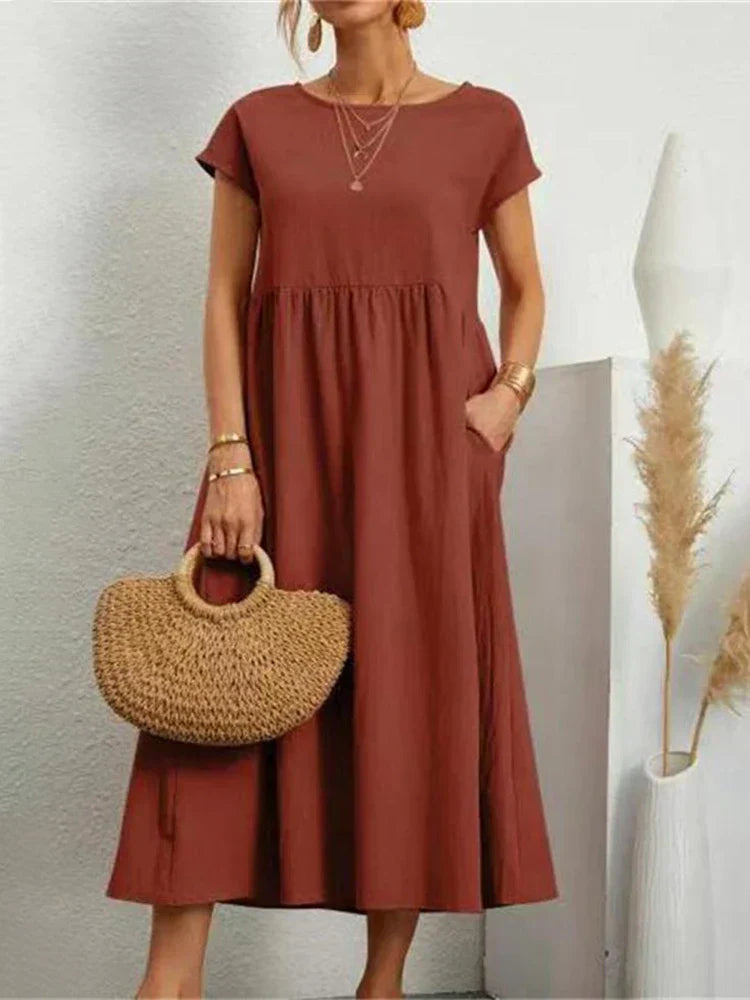 "Comfortabele vintage O-hals zomerjurk van ademend katoen, ideaal voor zomerse dagen; veelzijdige elegante stijl."