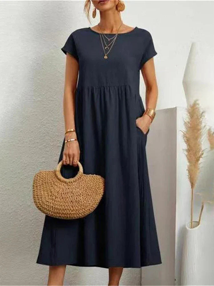 "Comfortabele vintage O-hals zomerjurk van ademend katoen, ideaal voor zomerse dagen; veelzijdige elegante stijl."