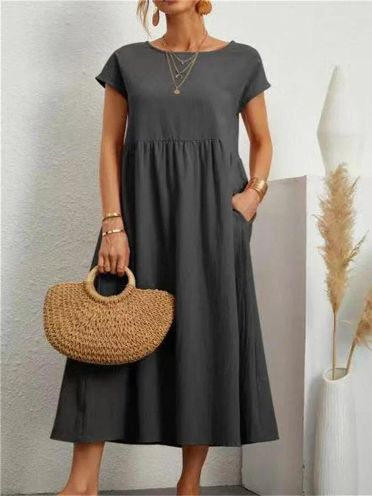"Comfortabele vintage O-hals zomerjurk van ademend katoen, ideaal voor zomerse dagen; veelzijdige elegante stijl."