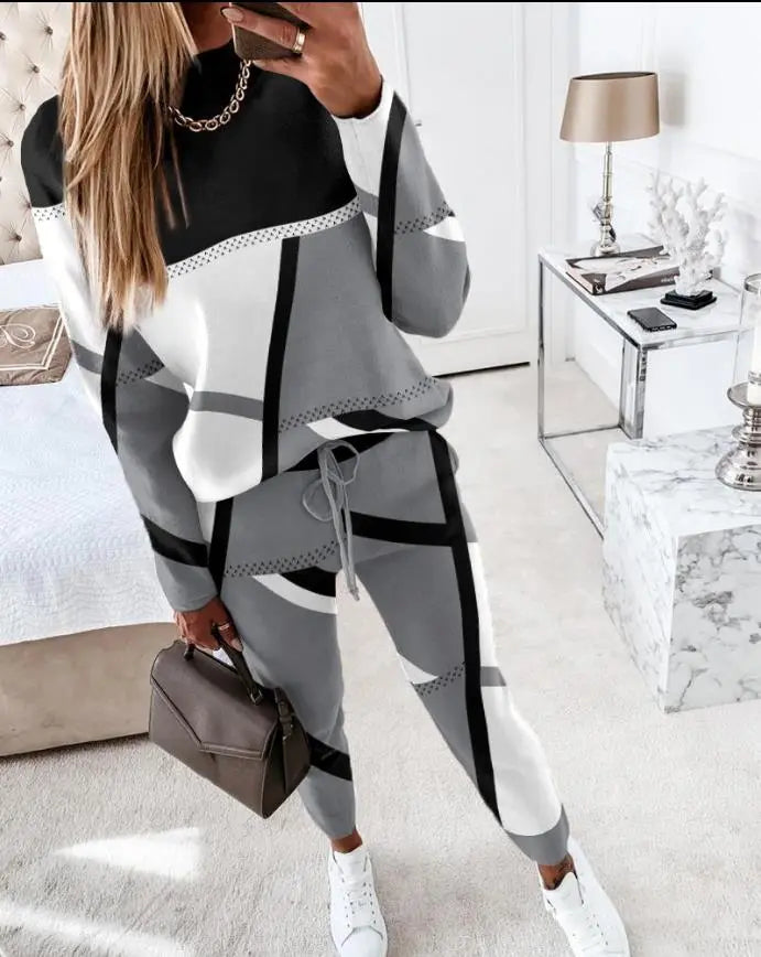 "Dames trainingspak met geometrisch patroon, relaxte pasvorm, ademend materiaal, ideaal voor casual en actieve styling."