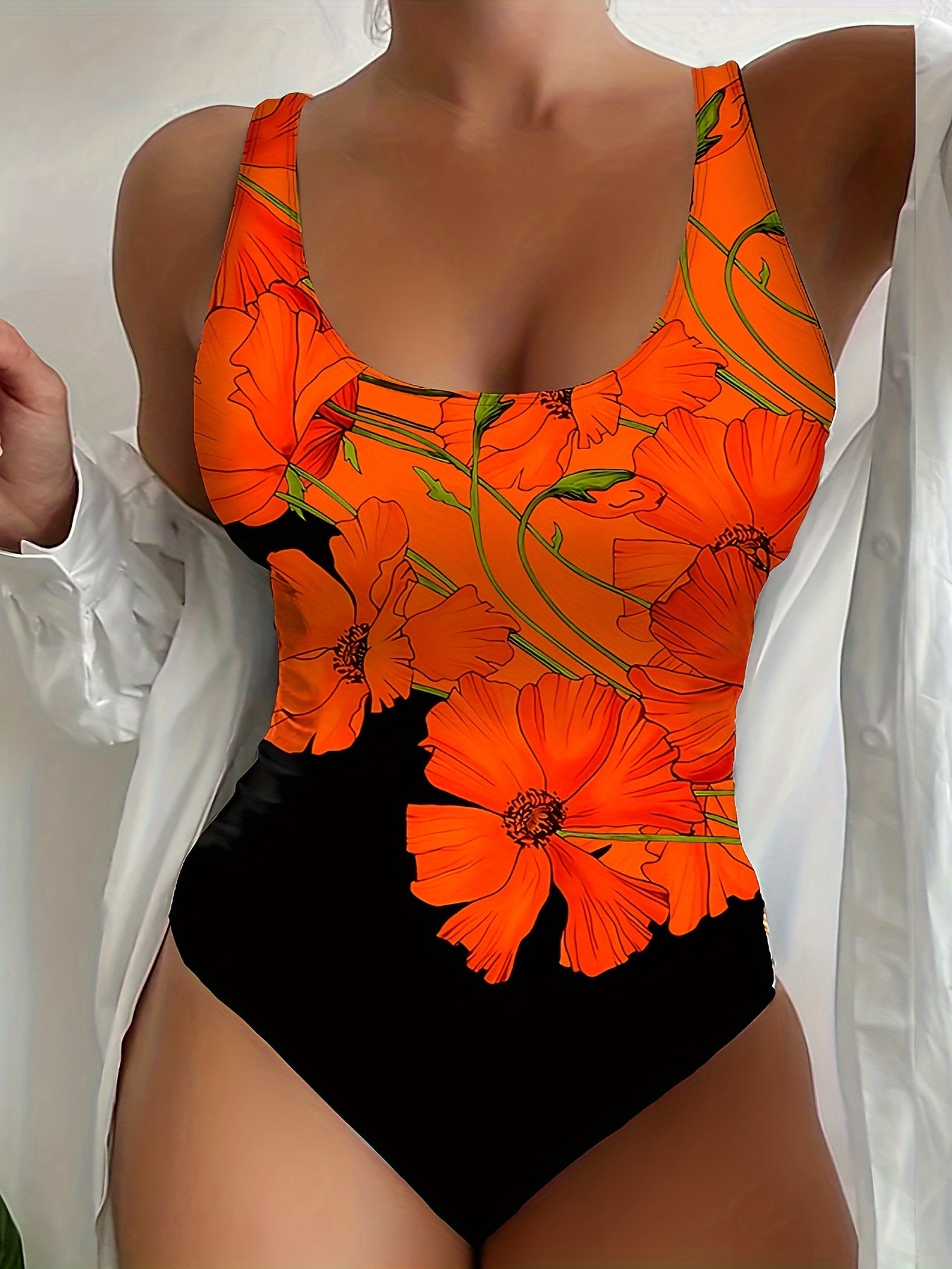 "Elegant eendelig damesbadpak met levendige bloemenprint, perfect voor zomerse strand- en zwembaddagen."