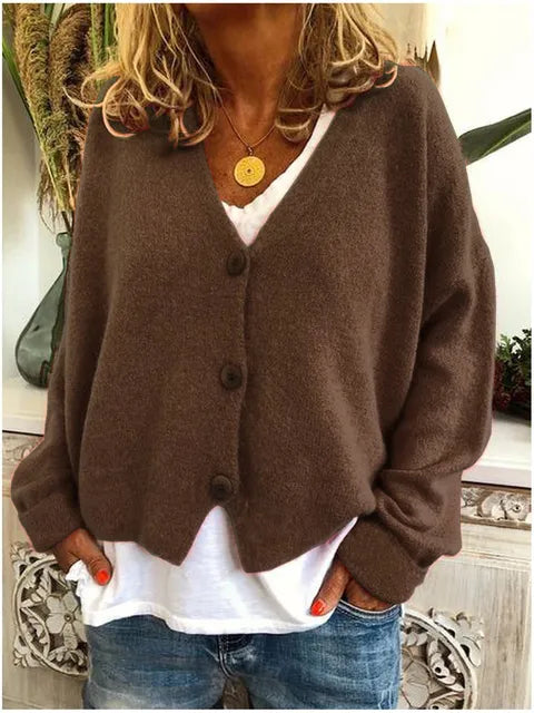 "Elegant katoenen dames vest met knopen, tijdloze stijl, zacht textuur, lange mouwen, perfect voor elke gelegenheid."