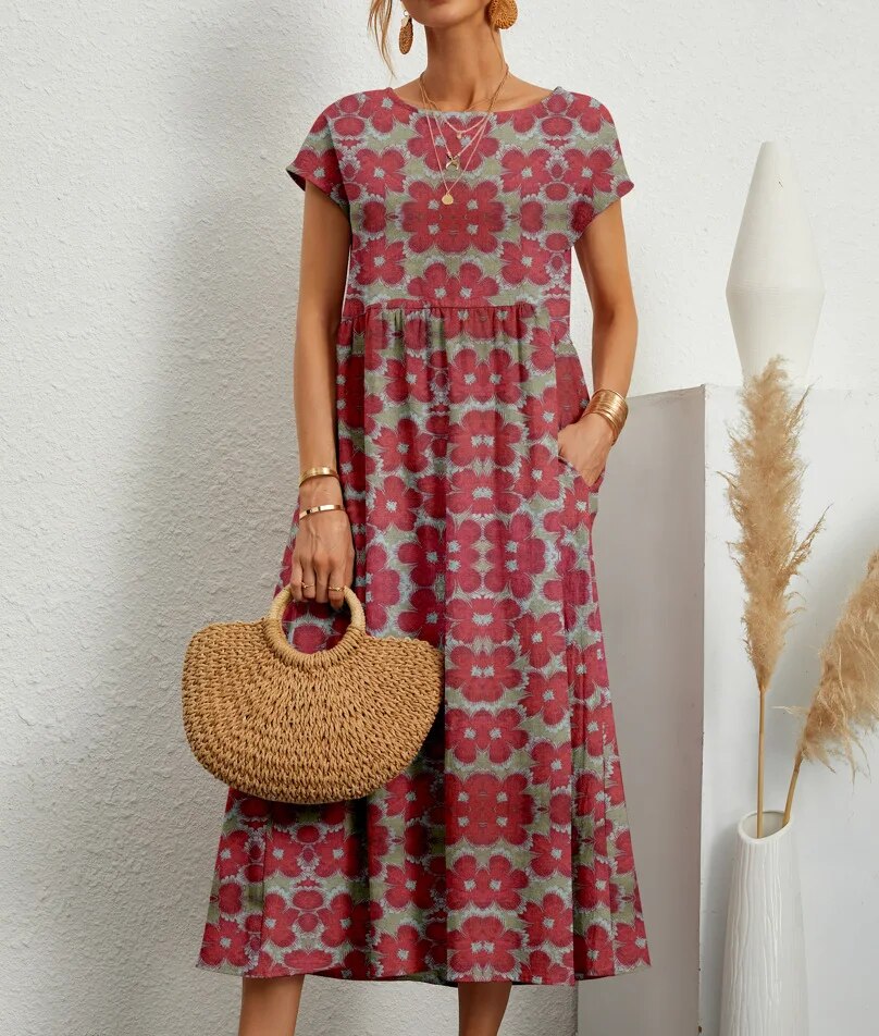 "Elegante A-lijn zomerjurk met kleurrijke bloemenprint, korte mouwen en lange rok, gemaakt van licht katoenen stof."