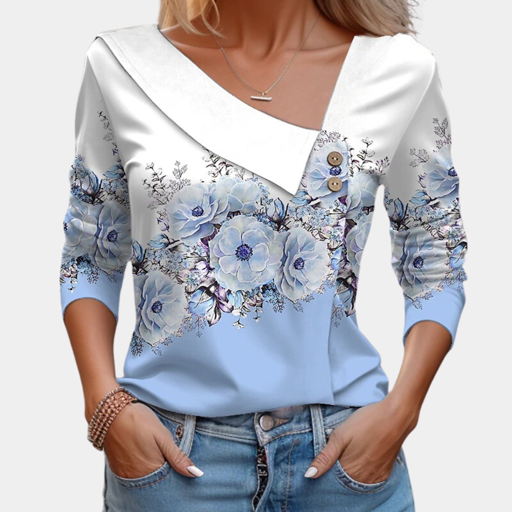 "Elegante damesblouse met bloemenpatroon in bruin, asymmetrisch design, geschikt voor casual en formele gelegenheden."