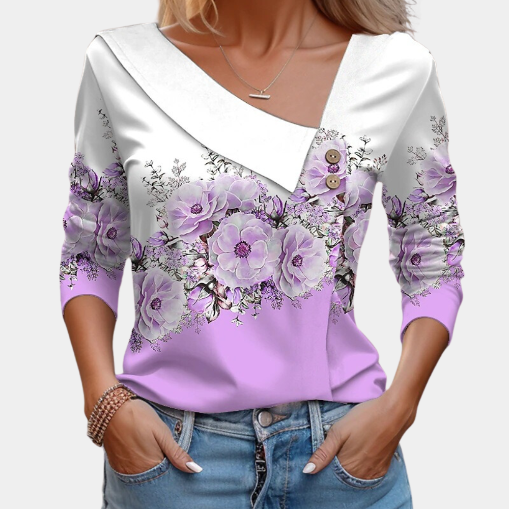 "Elegante damesblouse met bloemenpatroon in bruin, asymmetrisch design, geschikt voor casual en formele gelegenheden."