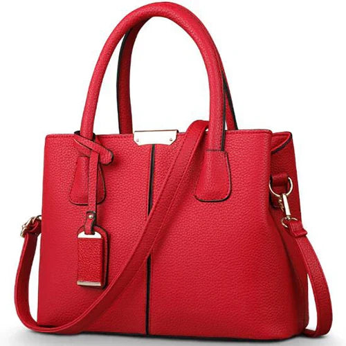 Elegante leren schoudertas voor dames, stijlvol en ruim, met verstelbare riem en verschillende kleurkeuzes.