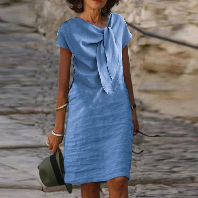 "Elegante midi-jurk met strikdetail, zomers, luchtige stof en lichte taillering. Perfect voor feesten en zomerse uitstapjes."
