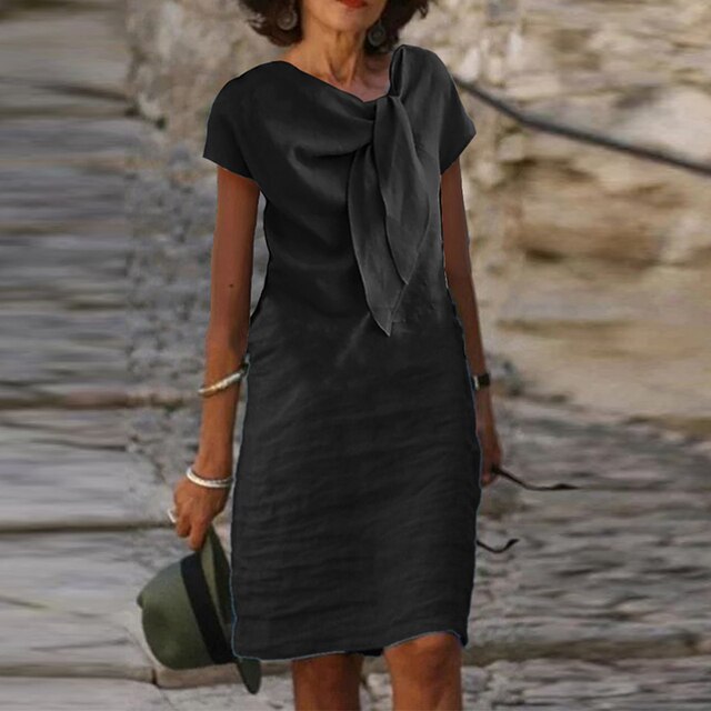 "Elegante midi-jurk met strikdetail, zomers, luchtige stof en lichte taillering. Perfect voor feesten en zomerse uitstapjes."