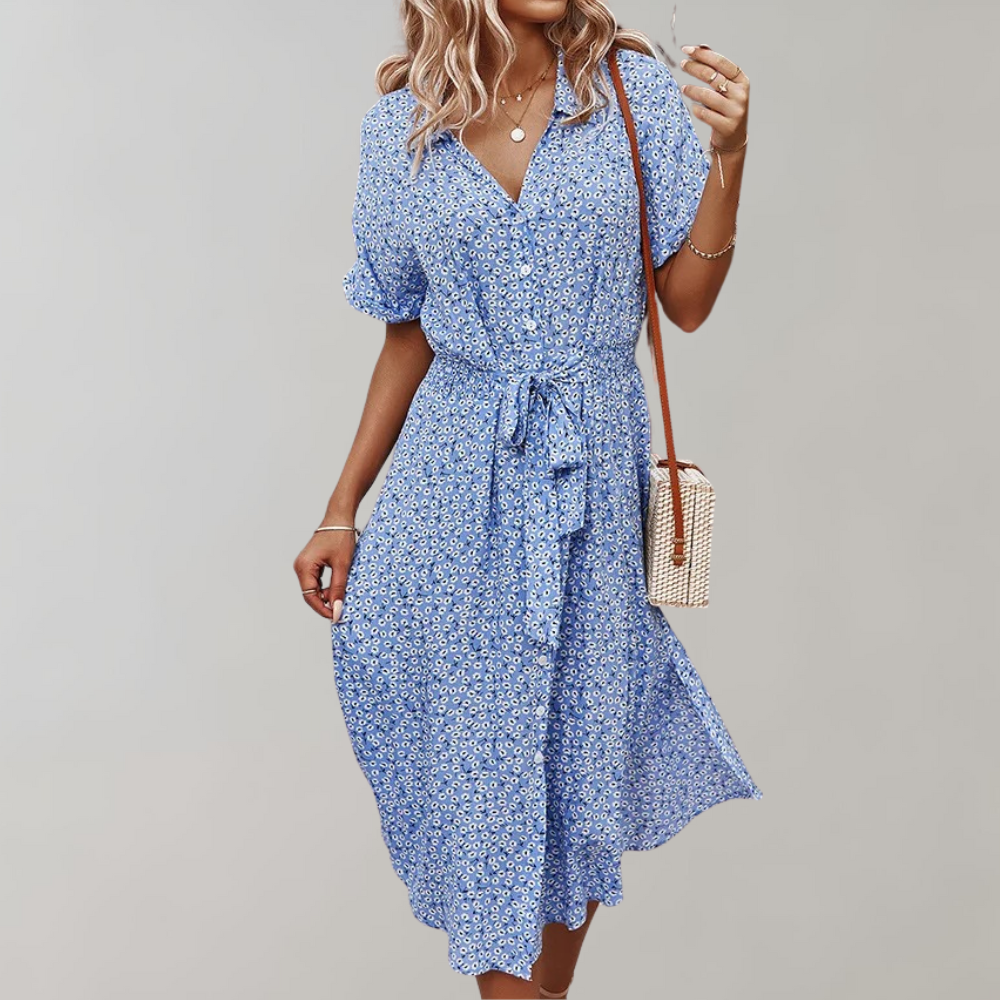 "Elegante midi zomerjurk met bloemenprint en korte mouwen, perfect voor damesmode in zowel casual als formele settings."