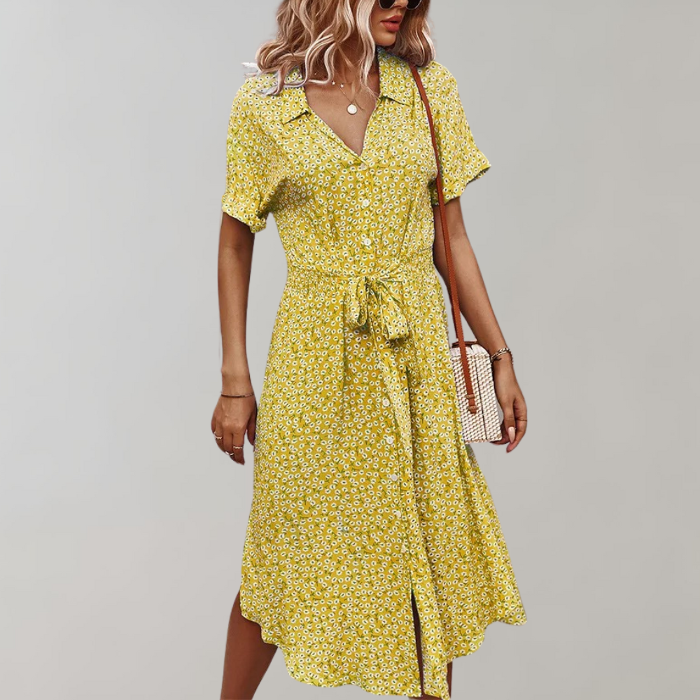 "Elegante midi zomerjurk met bloemenprint en korte mouwen, perfect voor damesmode in zowel casual als formele settings."