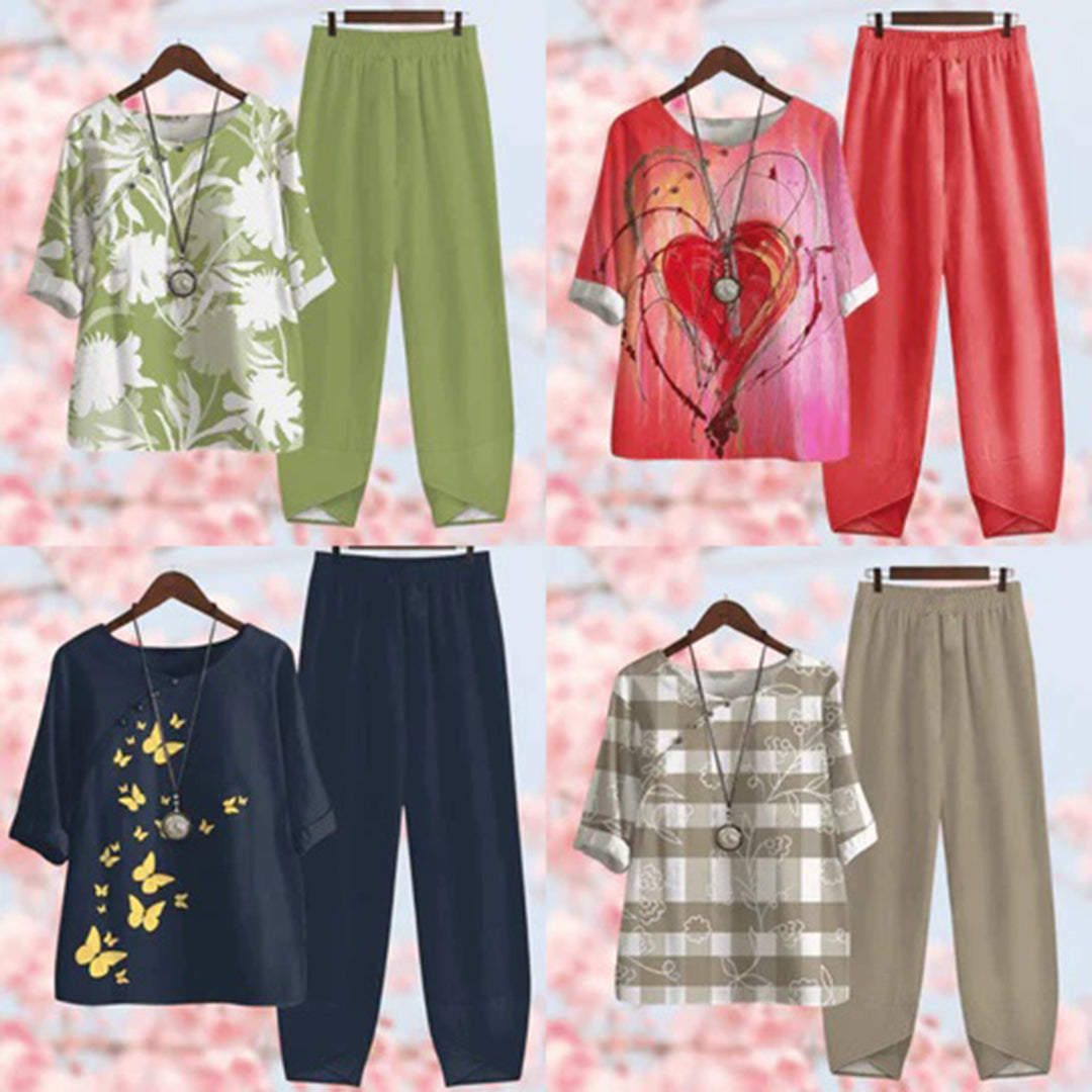 Elegante tweedelige set met vintage bloemenprint, losse top met korte mouwen en high-waist broek, stijlvol en comfortabel.