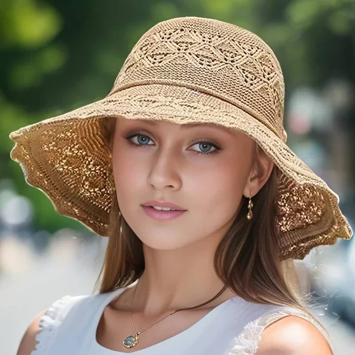 "Elegante zonnehoed met brede rand voor UV-bescherming, stijlvolle zomerse accessoire, beige kleur, lichtgewicht ontwerp."