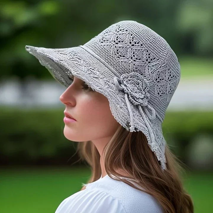 "Elegante zonnehoed met brede rand voor UV-bescherming, stijlvolle zomerse accessoire, beige kleur, lichtgewicht ontwerp."