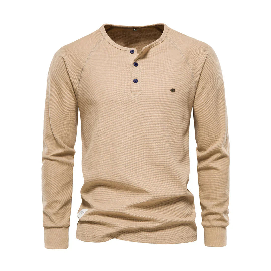 "Heren langemouwenshirt met ronde hals en knoopsluiting, beschikbaar in marineblauw, groen, lichtgrijs en wit."