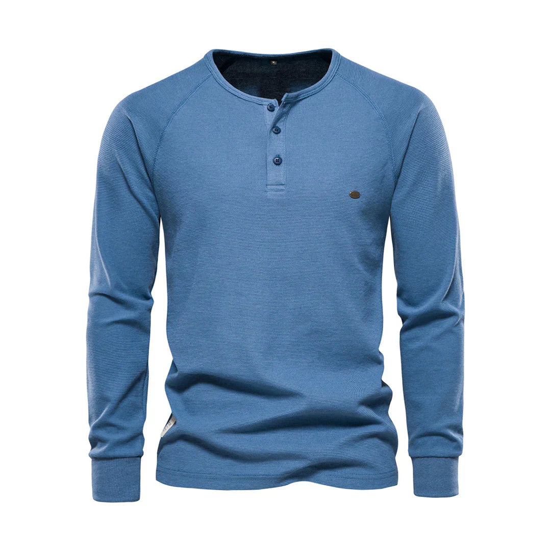 "Heren langemouwenshirt met ronde hals en knoopsluiting, beschikbaar in marineblauw, groen, lichtgrijs en wit."
