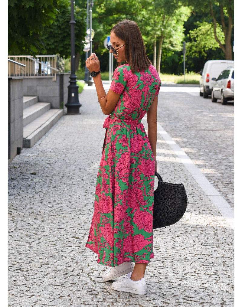 "Jade maxi jurk met levendige bloemenprint, V-hals en hoge split; ideale zomerse damesjurk voor strand of feest."