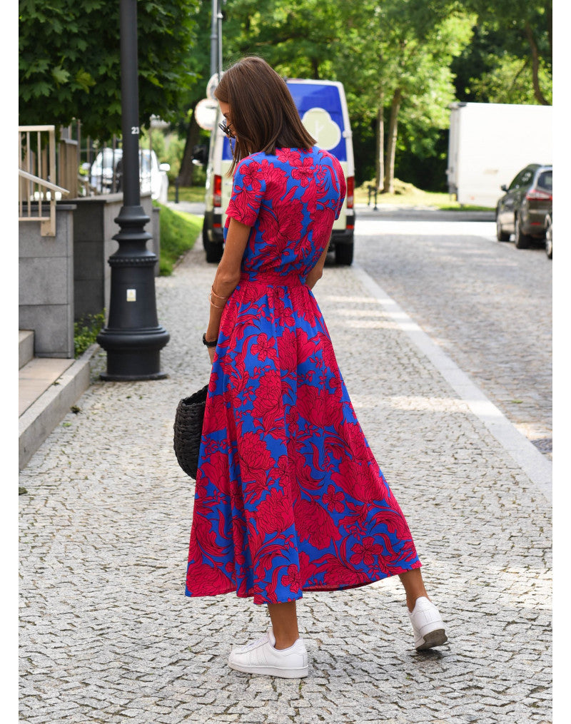 "Jade maxi jurk met levendige bloemenprint, V-hals en hoge split; ideale zomerse damesjurk voor strand of feest."