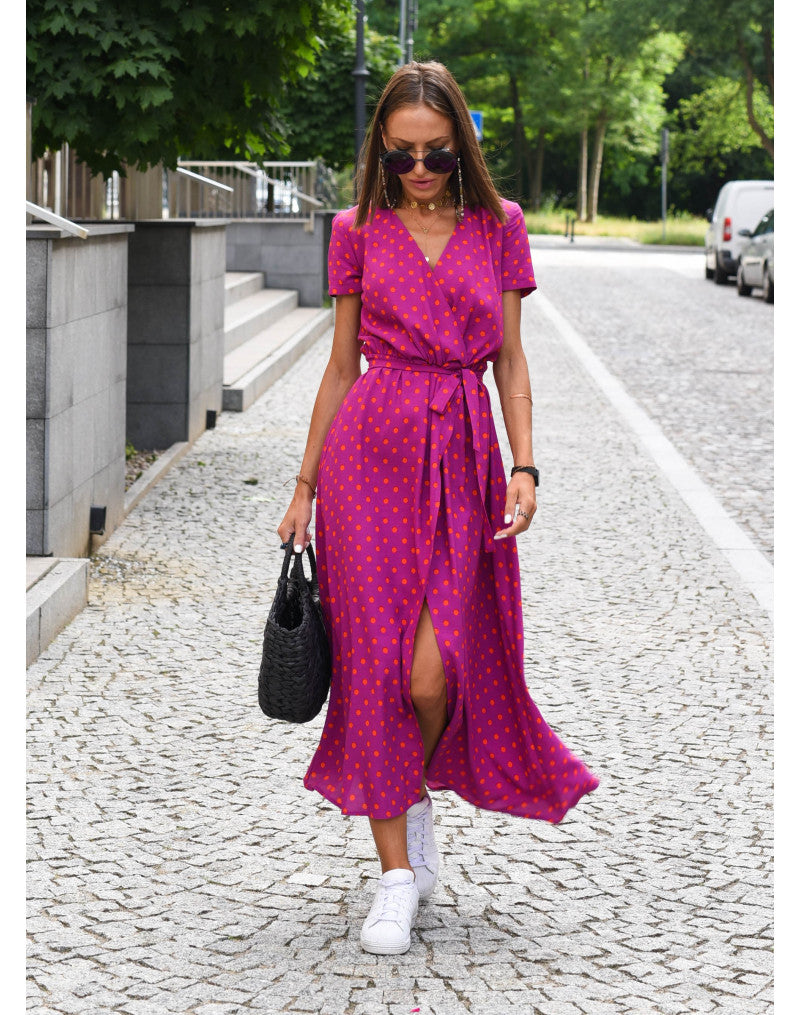 "Jade maxi jurk met levendige bloemenprint, V-hals en hoge split; ideale zomerse damesjurk voor strand of feest."