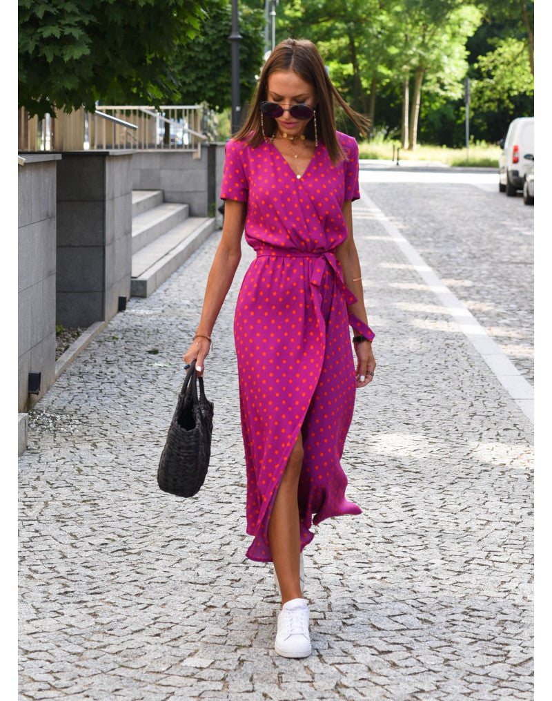 "Jade maxi jurk met levendige bloemenprint, V-hals en hoge split; ideale zomerse damesjurk voor strand of feest."
