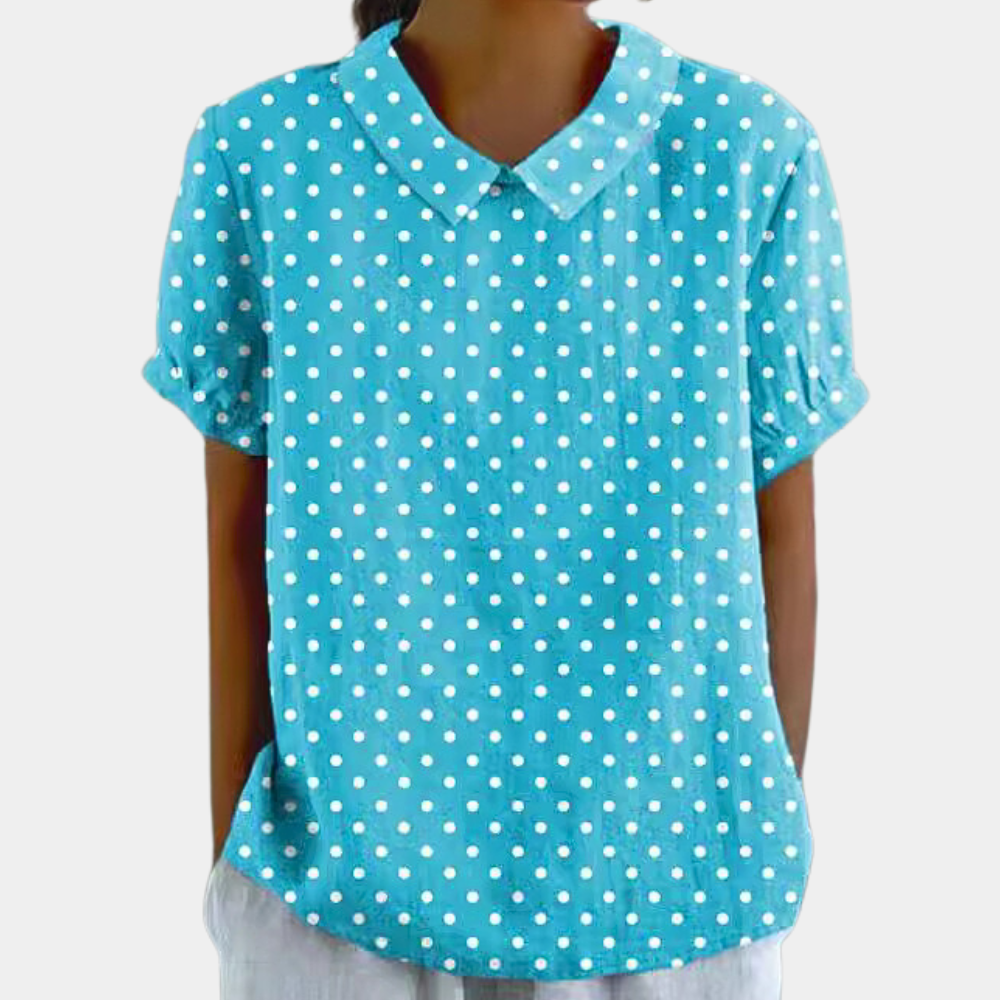 Kleurrijke damesblouse met bloemenpatroon, korte mouwen en ronde kraag, ideaal voor casual zomeroutfits.