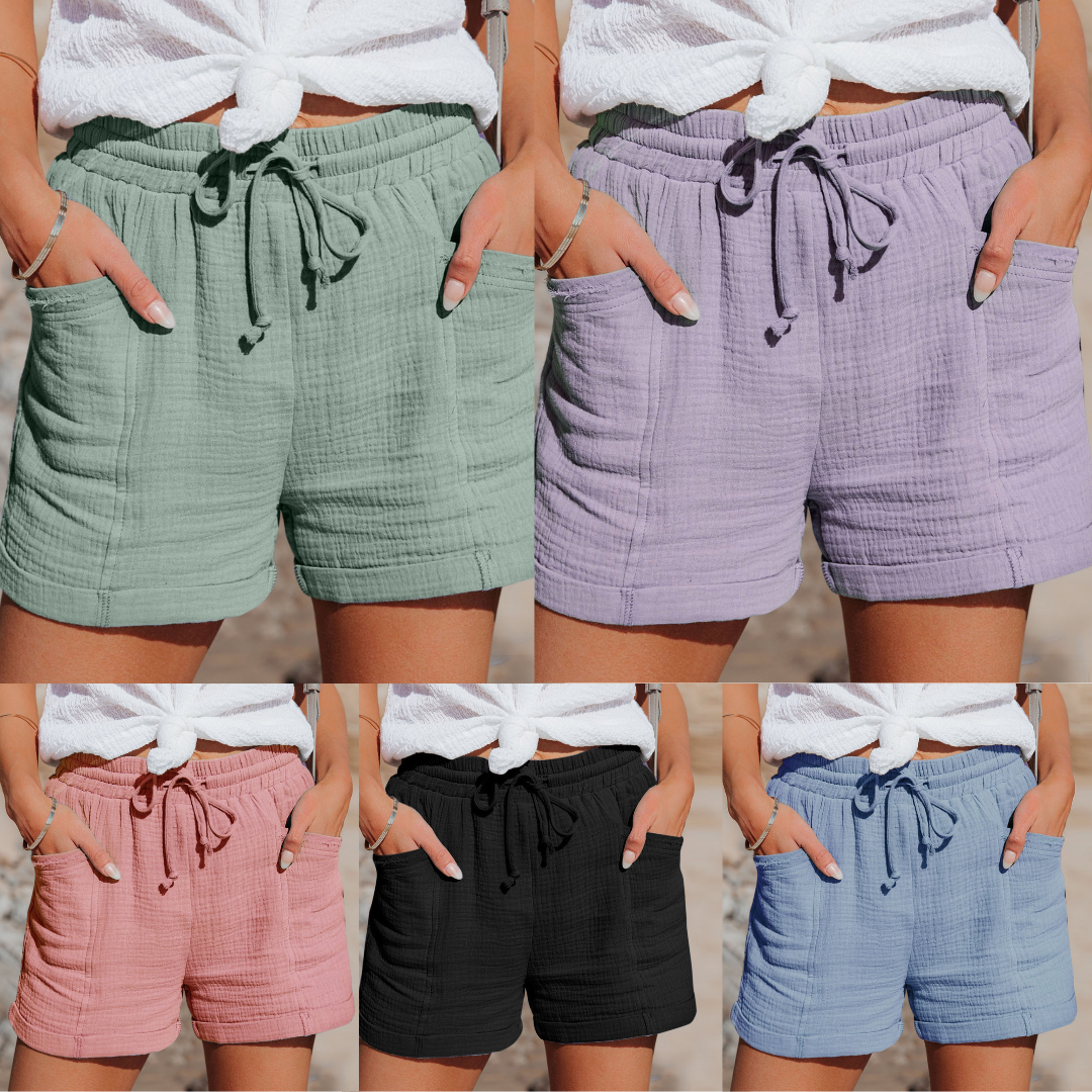 "Korte ademende katoenen dames shorts met verstelbare tailleband en zakken in diverse kleuren, ideaal voor de zomer."