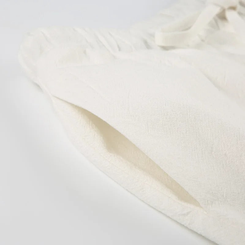 "Linnen dames zomerbroek met comfortabele pasvorm, chic design, luchtig en stijlvol, verkrijgbaar in neutrale kleuren."