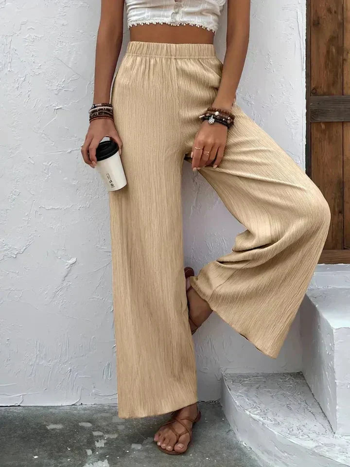 "Luchtige boho-stijl dames palazzo broek met wijde pijpen en elastische tailleband, ideaal voor zomer en casual looks."