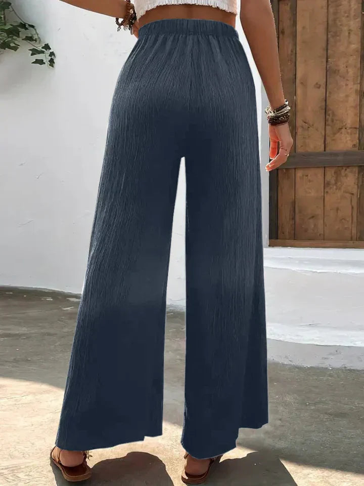 "Luchtige boho-stijl dames palazzo broek met wijde pijpen en elastische tailleband, ideaal voor zomer en casual looks."