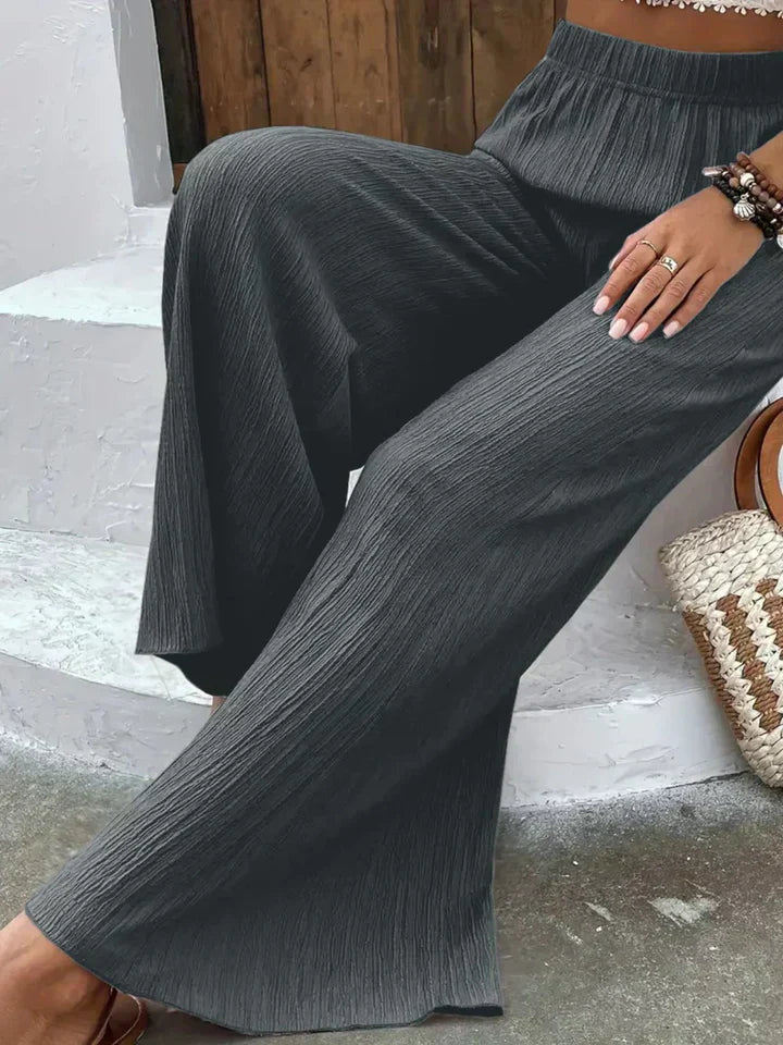 "Luchtige boho-stijl dames palazzo broek met wijde pijpen en elastische tailleband, ideaal voor zomer en casual looks."