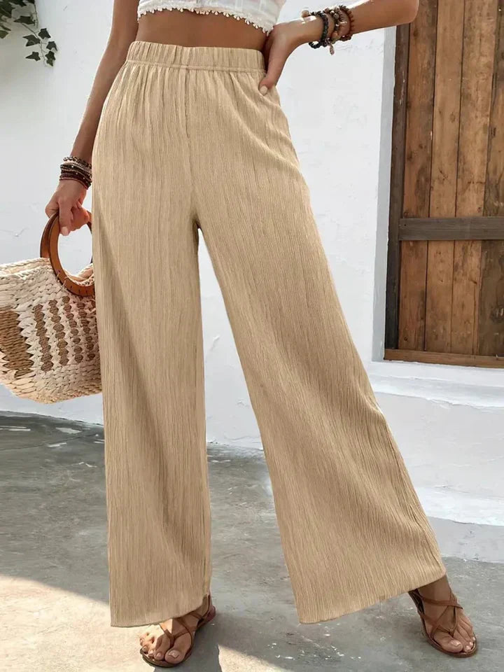 "Luchtige boho-stijl dames palazzo broek met wijde pijpen en elastische tailleband, ideaal voor zomer en casual looks."