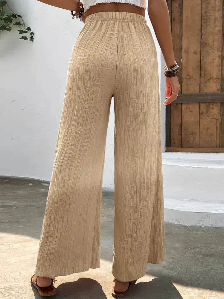 "Luchtige boho-stijl dames palazzo broek met wijde pijpen en elastische tailleband, ideaal voor zomer en casual looks."