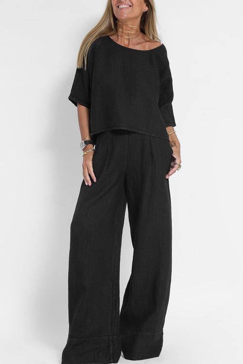"Luchtige katoenen-linnen tweedelige set met wijde broek en cropped top, perfect voor zomerse elegantie en comfort."