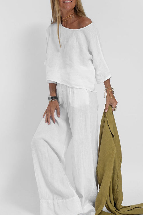 "Luchtige katoenen-linnen tweedelige set met wijde broek en cropped top, perfect voor zomerse elegantie en comfort."