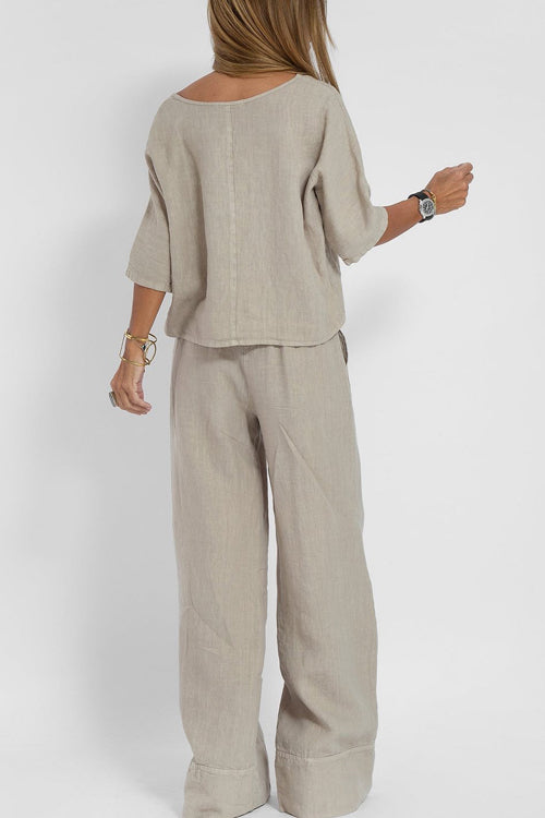 "Luchtige katoenen-linnen tweedelige set met wijde broek en cropped top, perfect voor zomerse elegantie en comfort."