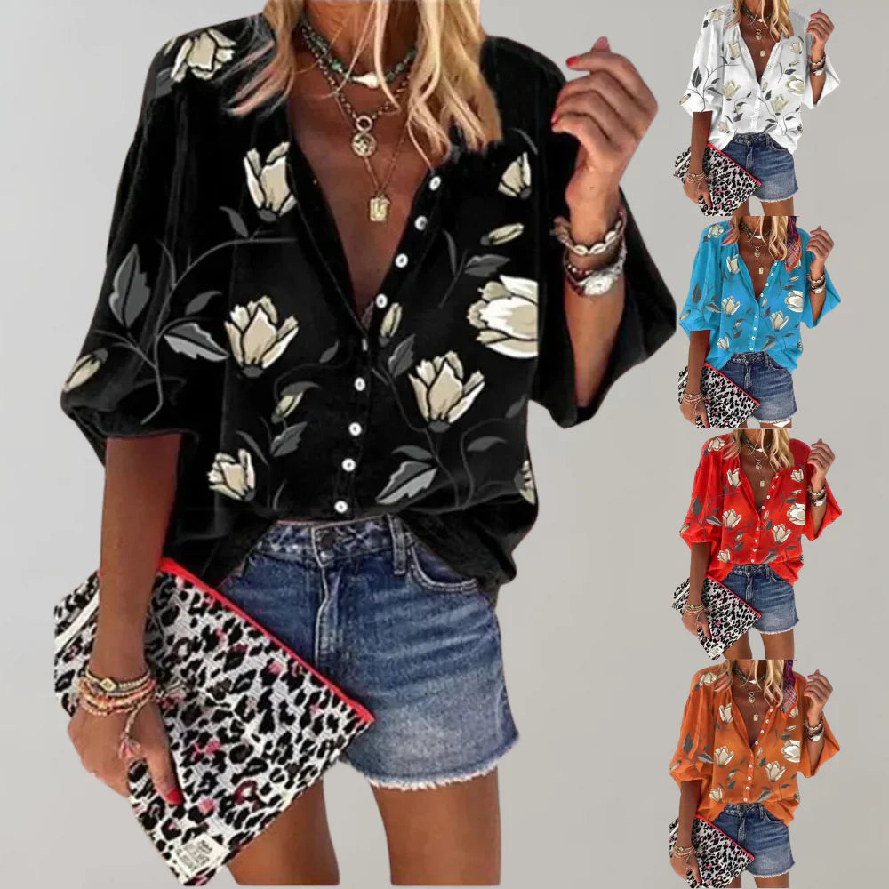"Luchtige zomerse damesblouse met kleurrijke bloemenprint en elegante lange pasvorm voor stijlvolle casual looks."