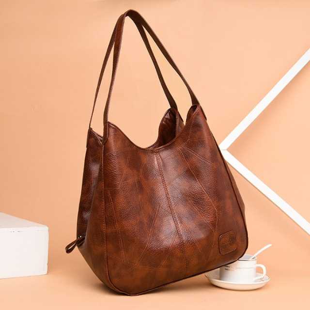 "Luxe leren schoudertas voor vrouwen, elegant design, duurzaam echt leer, ruim met georganiseerde vakken."