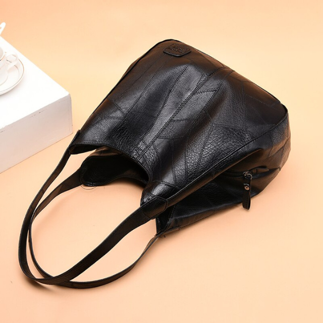 "Luxe leren schoudertas voor vrouwen, elegant design, duurzaam echt leer, ruim met georganiseerde vakken."