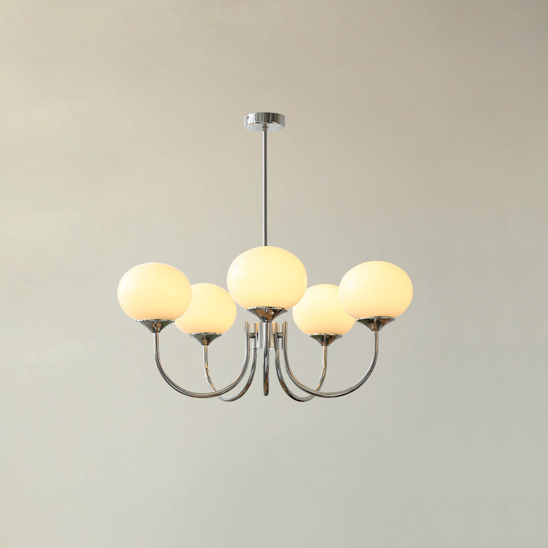 "Moderne kroonluchter met gouden afwerking en roze glazen kappen, geschikt voor LED verlichting in eigentijds interieur."