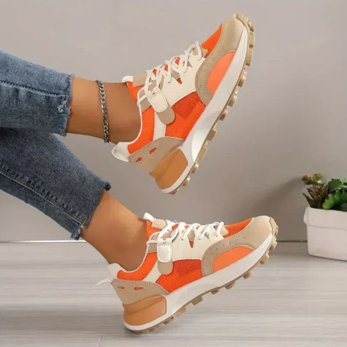 "Modieuze colorblock dames sneakers, chique en comfortabel, met trendy patroon en hoogwaardige materialen in oranje."