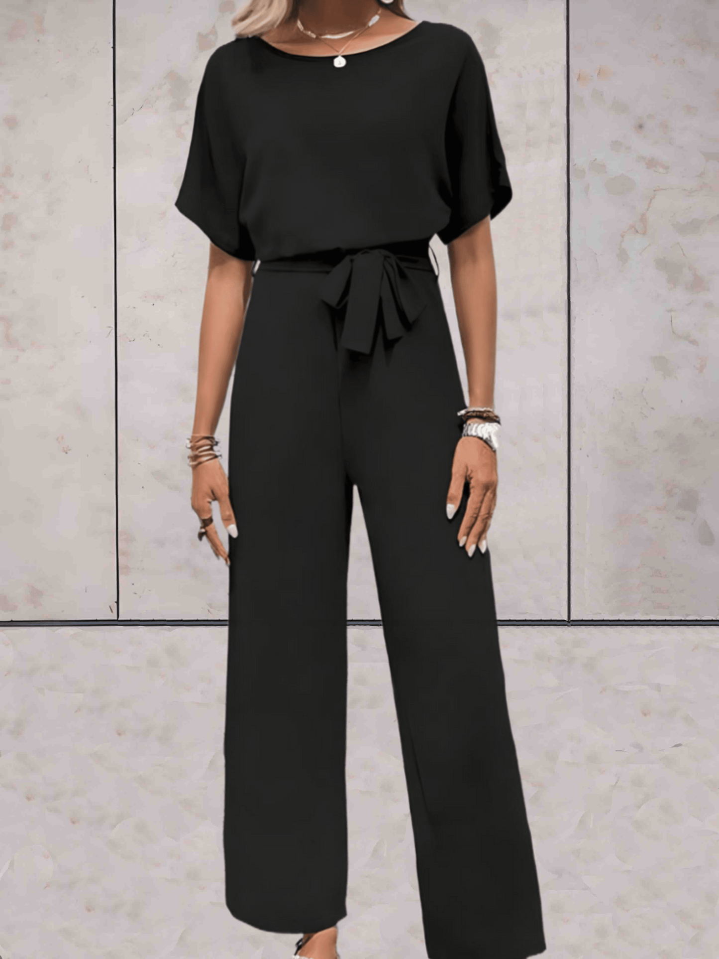 "Noa jumpsuit dames, stijlvol en comfortabel, wijde mouwen, striklinten, ademende stof, chic en veelzijdig."