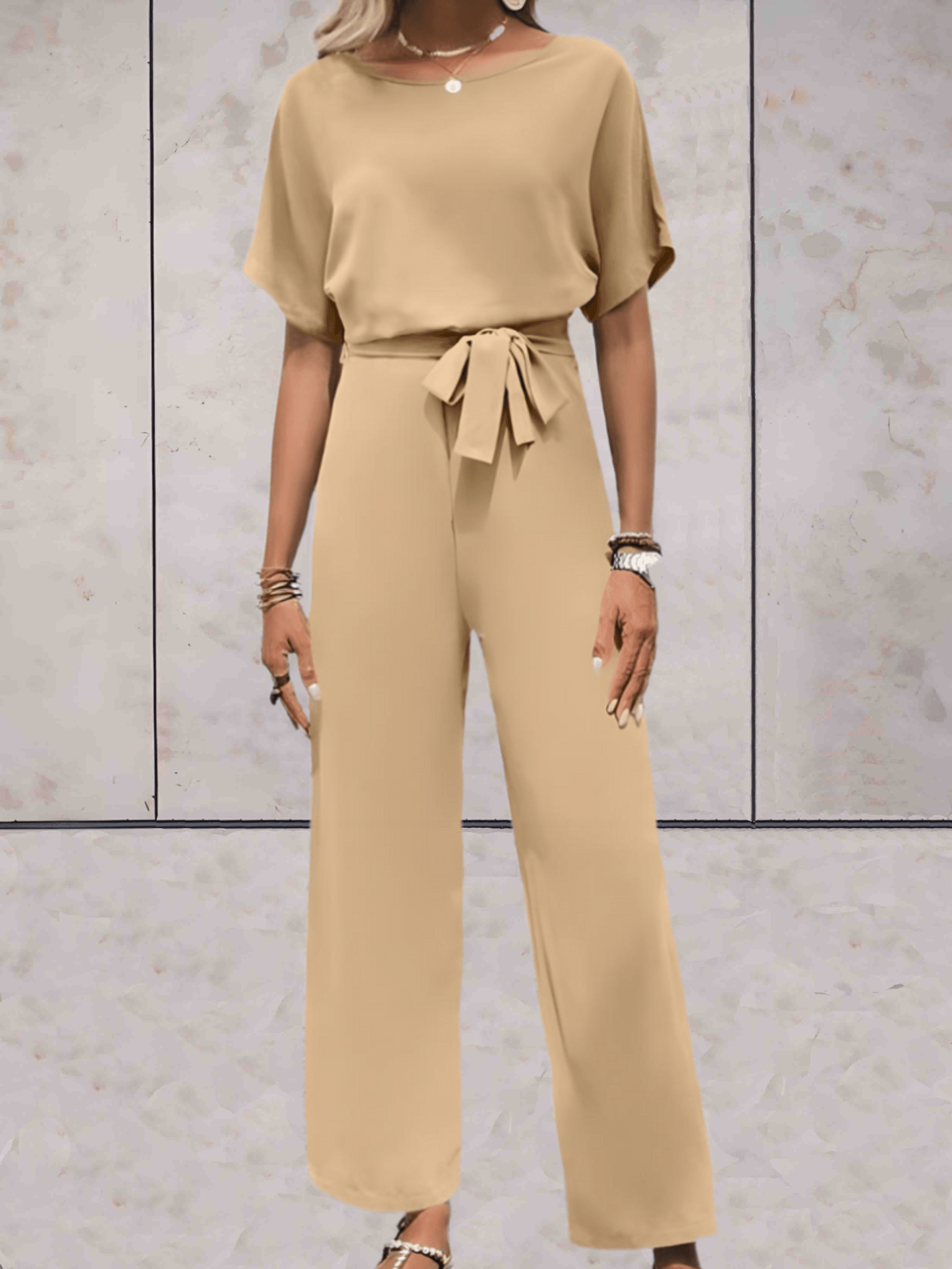 "Noa jumpsuit dames, stijlvol en comfortabel, wijde mouwen, striklinten, ademende stof, chic en veelzijdig."