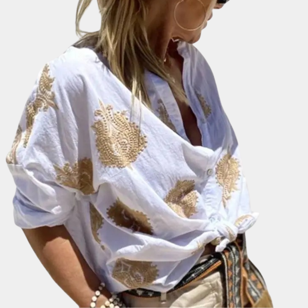 "Prachtige damesblouse met lange mouwen, unieke print en levendige kleuren, ideaal voor elke gelegenheid."