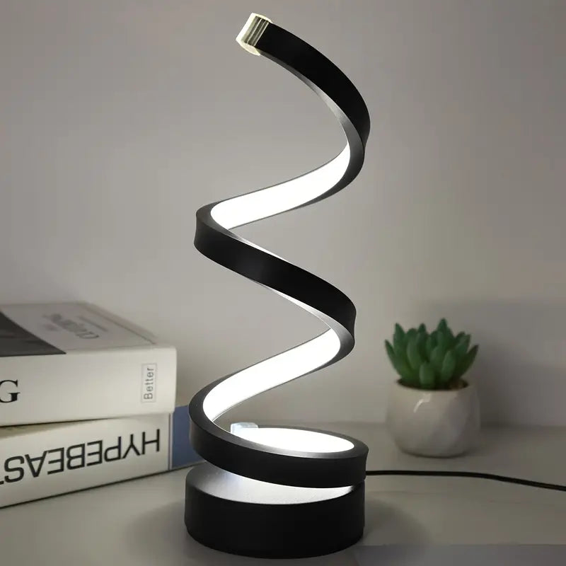 "Spiraalvormige moderne tafellamp met dimbare LED-verlichting op een houten tafel voor een stijlvolle ambiance in de kamer."
