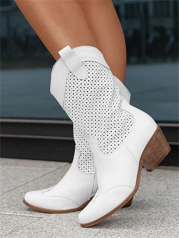 "Stijlvolle witte dames cowboylaarzen met perforaties en blokhak, moderne western look, perfect voor elk seizoen."