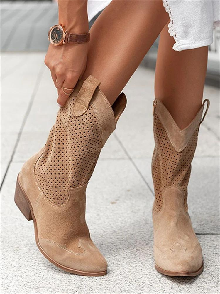 "Stijlvolle witte dames cowboylaarzen met perforaties en blokhak, moderne western look, perfect voor elk seizoen."
