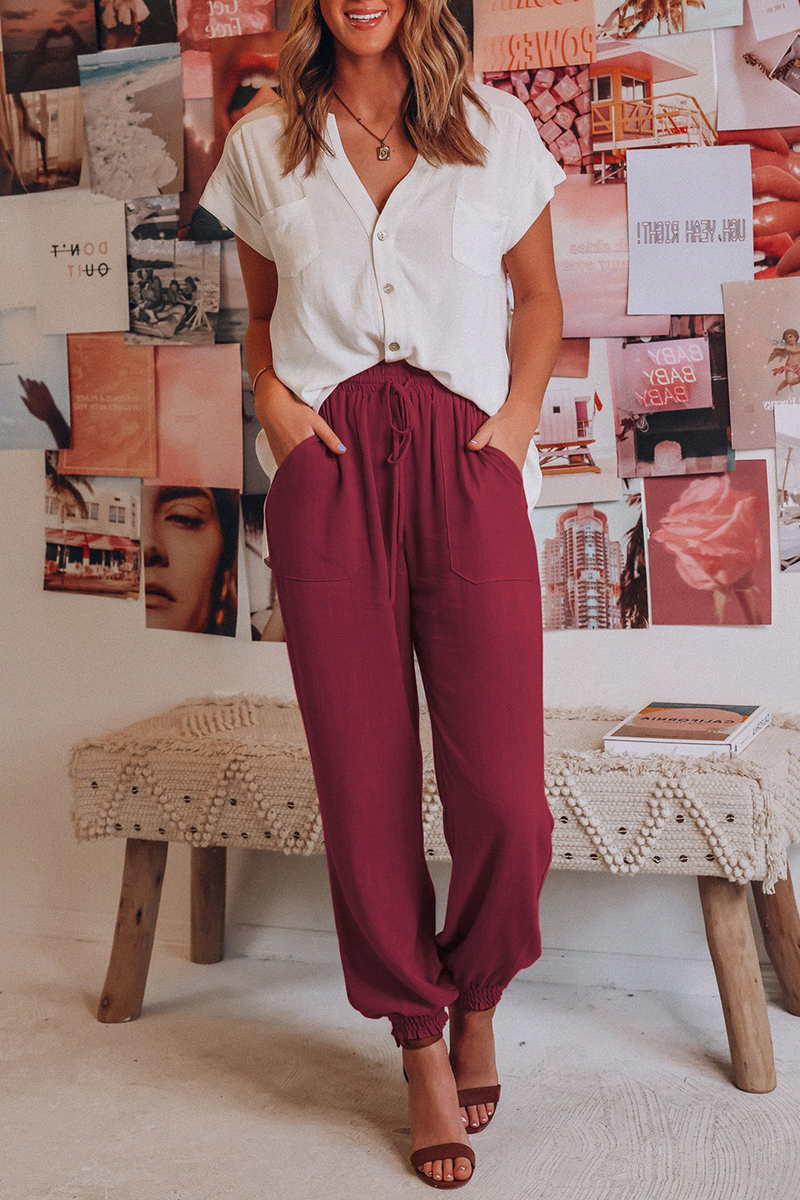 "Trendy dames harembroek, elastische tailleband, luchtig materiaal, losvallend bij heupen, taps toelopend naar enkels."