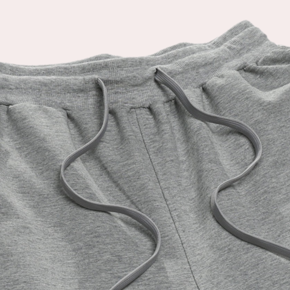 "Zomerse heren joggingbroek in oversized stijl, katoenmix, met elastische tailleband en trekkoord voor optimaal comfort."